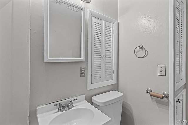 bathroom with sink and toilet