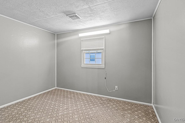 empty room featuring a textured ceiling