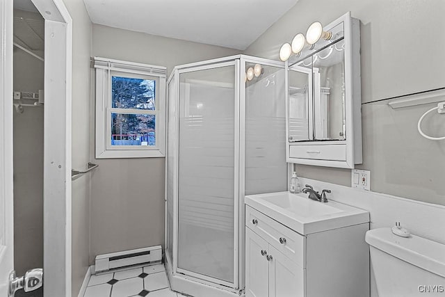 bathroom featuring an enclosed shower, vanity, a baseboard radiator, and toilet