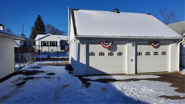 exterior space featuring an outbuilding and a garage