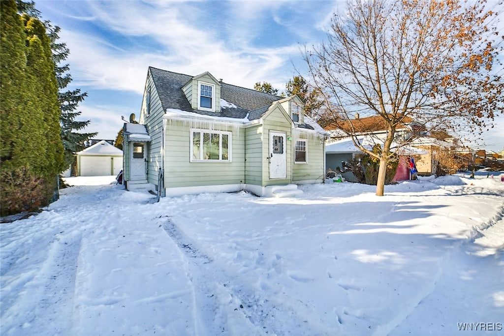 view of front of house with an outbuilding and a garage