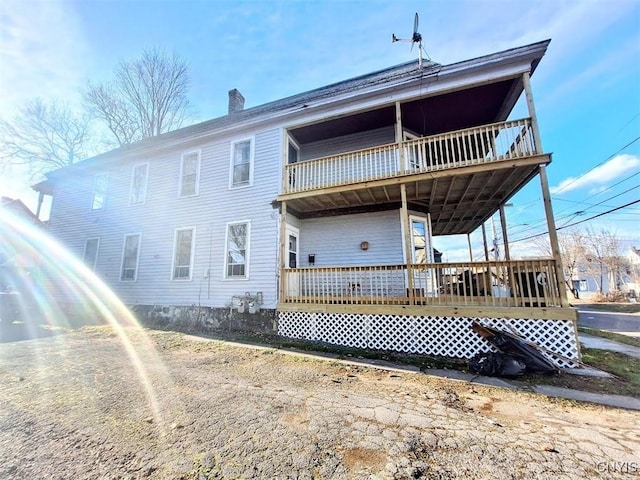 rear view of property with a deck