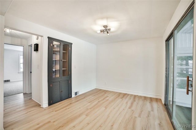 empty room featuring light hardwood / wood-style floors