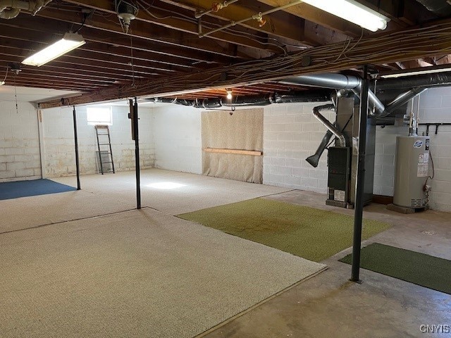 basement featuring heating unit and water heater