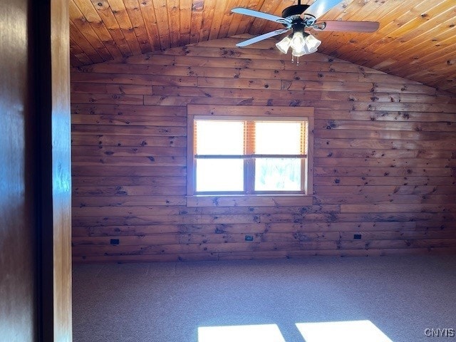 spare room with vaulted ceiling, ceiling fan, and wood ceiling