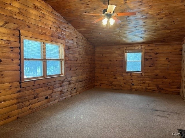 bonus room with rustic walls, vaulted ceiling, wooden ceiling, ceiling fan, and carpet