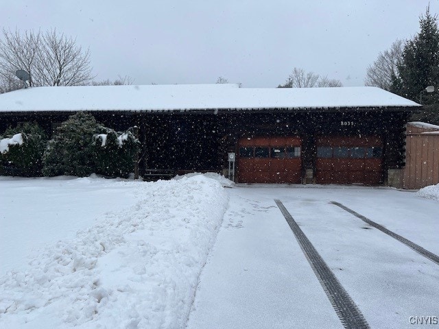 view of yard layered in snow