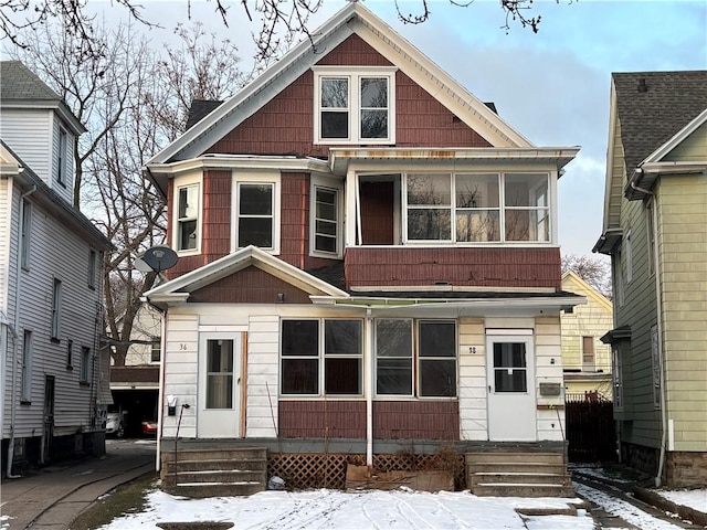 view of front of house featuring a sunroom