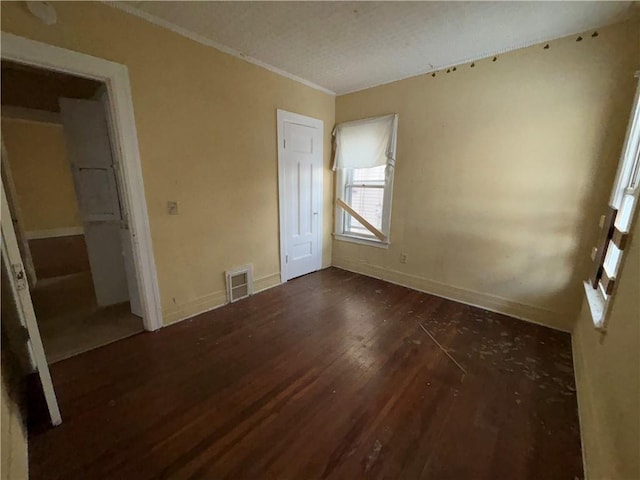 unfurnished bedroom with dark wood-type flooring