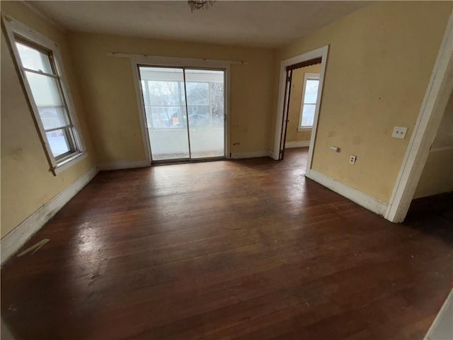 unfurnished room featuring dark hardwood / wood-style flooring