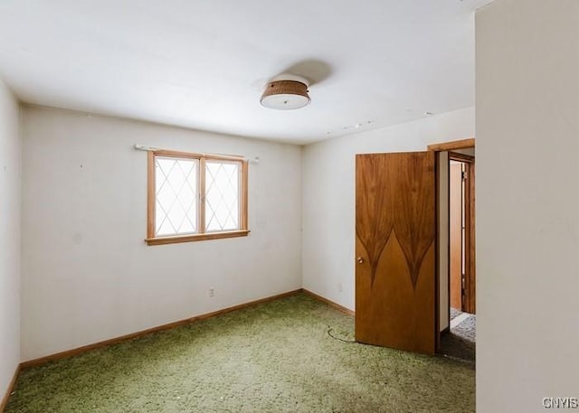 empty room featuring baseboards