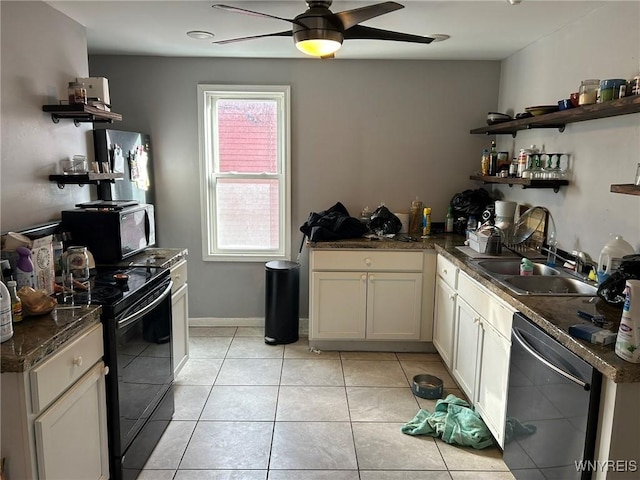 kitchen with light tile patterned flooring, a wealth of natural light, ceiling fan, and black appliances