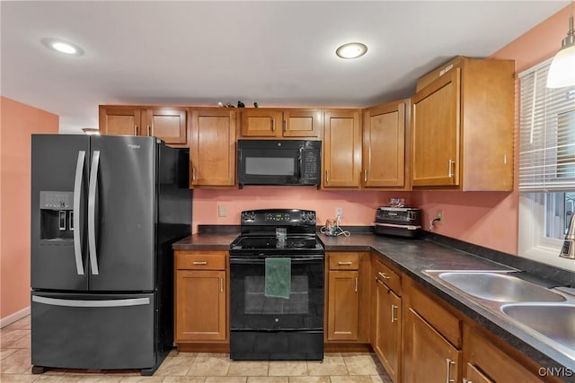 kitchen with sink and black appliances