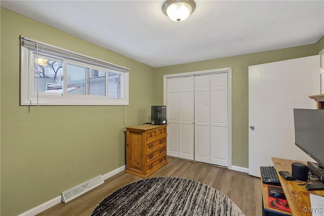 bedroom with a closet and light wood-type flooring