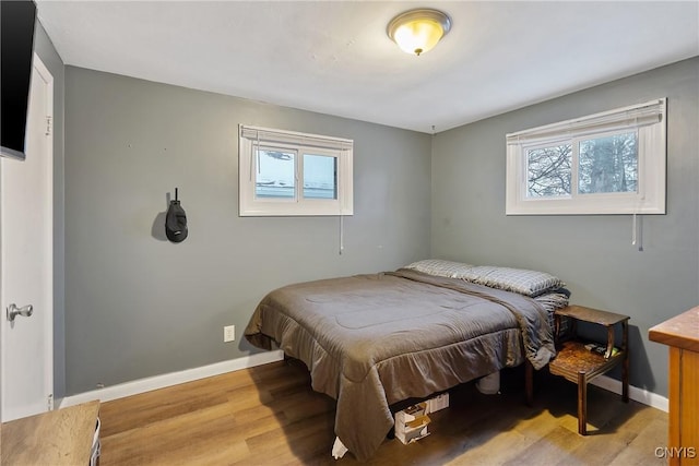 bedroom with light hardwood / wood-style floors