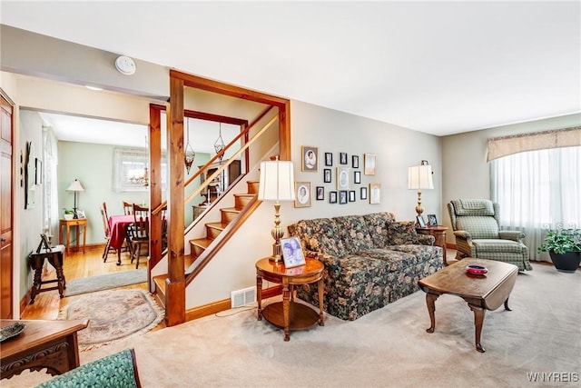 living room featuring light carpet