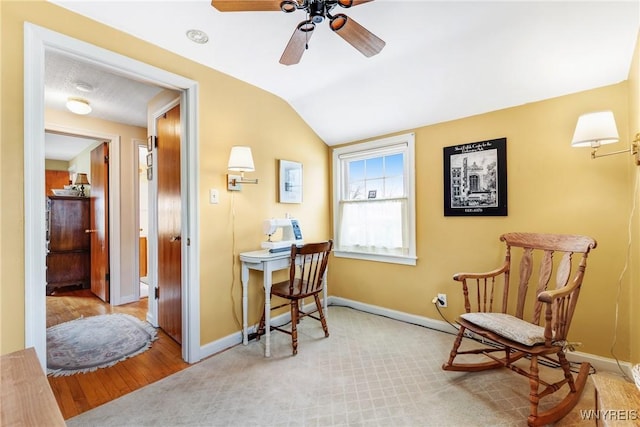 home office with vaulted ceiling and ceiling fan