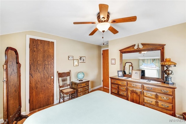 bedroom featuring vaulted ceiling and ceiling fan