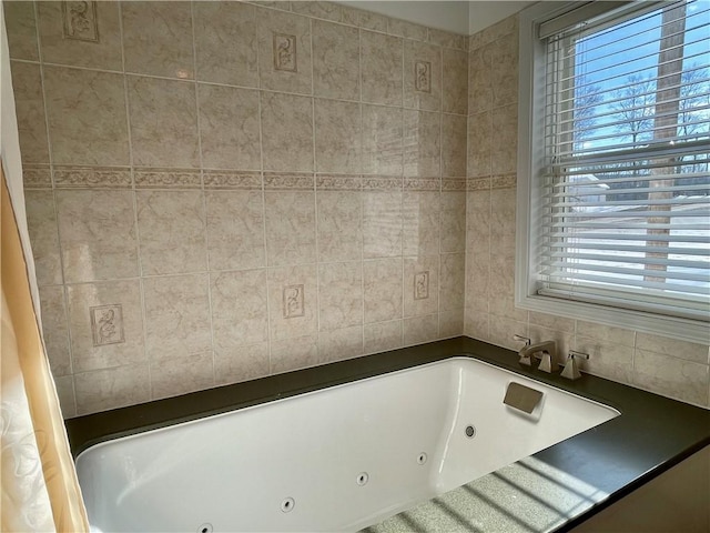 3843 Charlotte Creek Rd, Davenport, NY 13750 - bathroom featuring a tub with jets and tile walls