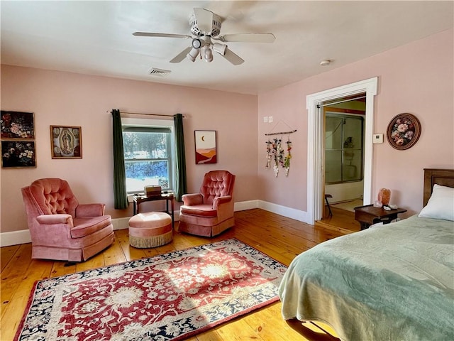 bedroom featuring hardwood / wood-style flooring and ceiling fan