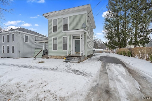 view of snow covered house