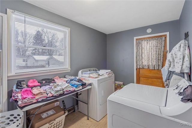 washroom with washer and dryer