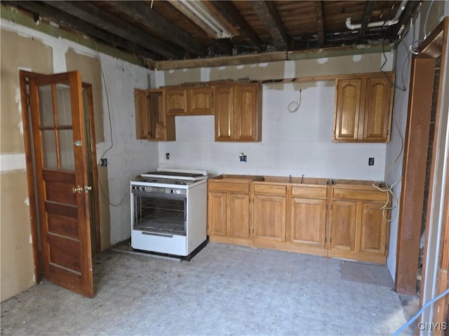 kitchen with white gas range oven