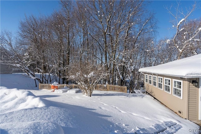 view of yard covered in snow