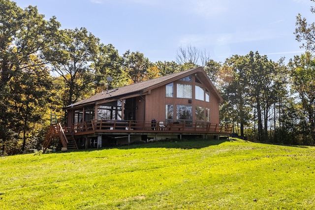 back of house with a yard and a deck