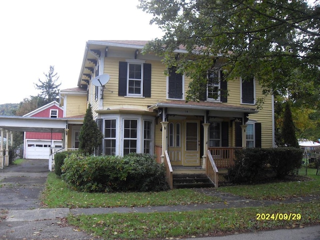 view of front of house with a garage and covered porch