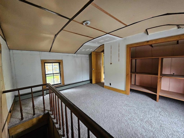 additional living space with lofted ceiling and carpet