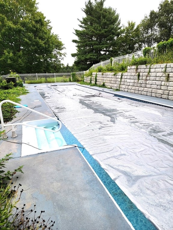 view of swimming pool featuring a patio area