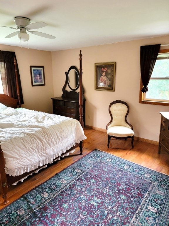 bedroom featuring light hardwood / wood-style flooring and ceiling fan