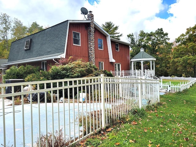 3530 Coats Rd, Hector, NY 14818 - view of property exterior with a gazebo, a chimney, and a gambrel roof