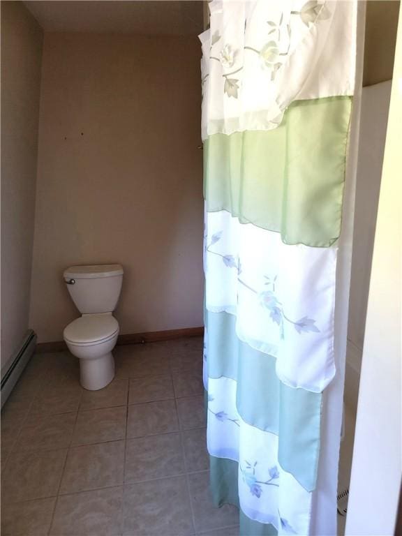 3530 Coats Rd, Hector, NY 14818 - bathroom with baseboards, tile patterned flooring, toilet, and a baseboard heating unit