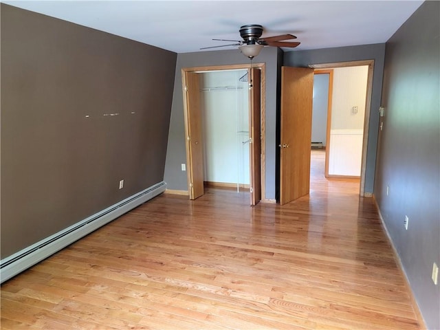 3530 Coats Rd, Hector, NY 14818 - unfurnished bedroom with a baseboard heating unit, light wood-type flooring, baseboards, and a closet