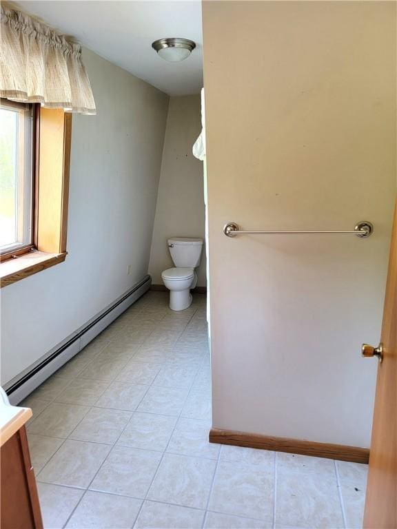 3530 Coats Rd, Hector, NY 14818 - bathroom with baseboard heating, toilet, tile patterned floors, and baseboards