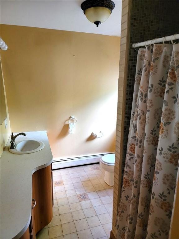 3530 Coats Rd, Hector, NY 14818 - full bath with a baseboard heating unit, toilet, tile patterned floors, vanity, and a shower with shower curtain