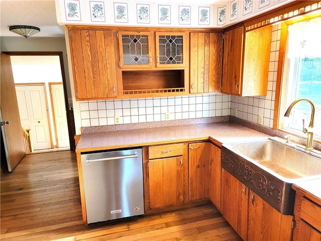 3530 Coats Rd, Hector, NY 14818 - kitchen with dishwasher, light wood-style flooring, light countertops, and tasteful backsplash