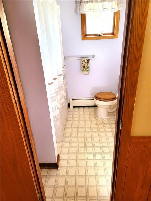 3530 Coats Rd, Hector, NY 14818 - bathroom with a baseboard radiator, tile patterned floors, toilet, and curtained shower