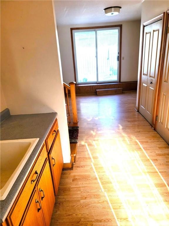 3530 Coats Rd, Hector, NY 14818 - corridor with light wood-style floors, a sink, and baseboards