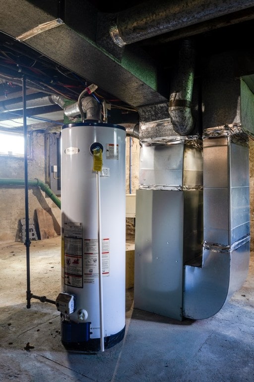 utility room with water heater