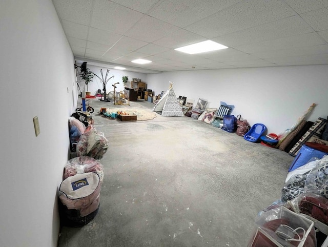 basement featuring a drop ceiling