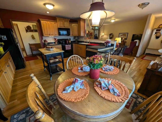 dining room with light wood-type flooring