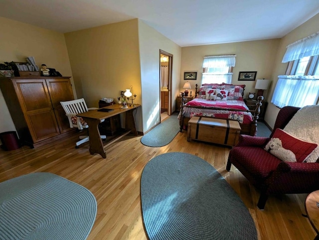 bedroom with light hardwood / wood-style flooring