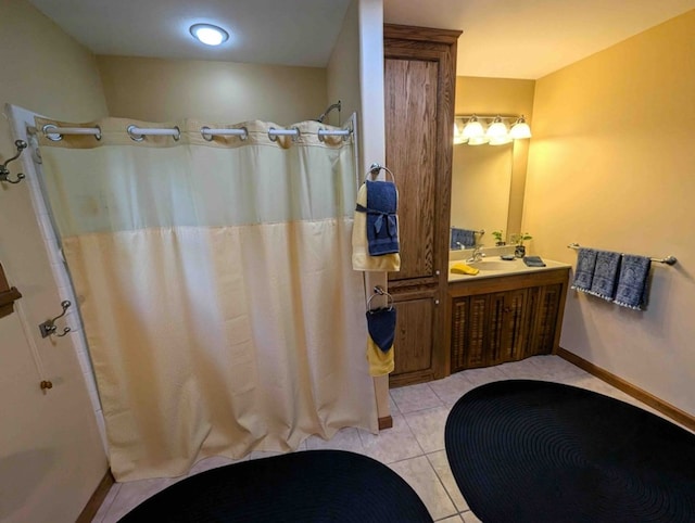 bathroom featuring a shower with shower curtain, vanity, and tile patterned flooring