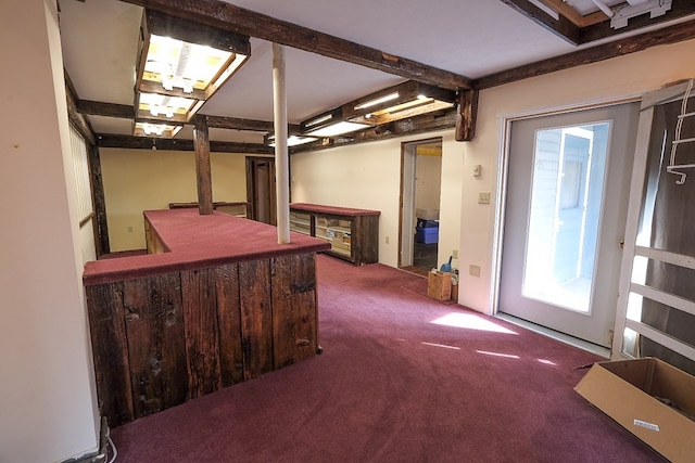 basement featuring dark colored carpet