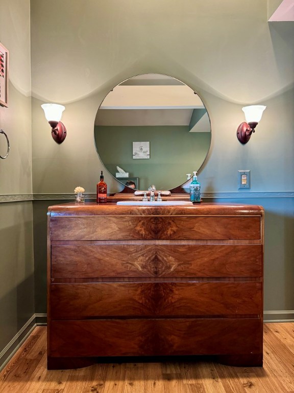 bathroom with vanity and hardwood / wood-style floors