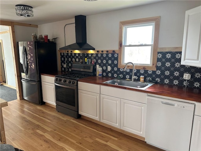 345 Ridge Rd, Veteran, NY 14845 - kitchen with stainless steel gas stove, dishwasher, a sink, black refrigerator with ice dispenser, and wall chimney exhaust hood