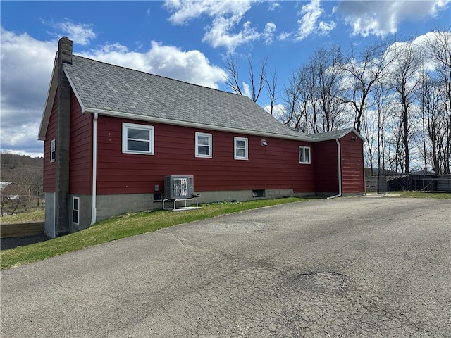 345 Ridge Rd, Veteran, NY 14845 - view of property exterior with ac unit, driveway, and a chimney